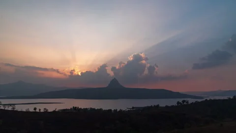 Timelapse - Sunset close shot behind a mountain 4K60 Stock Footage 268789472