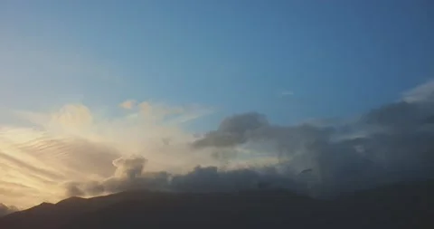 Timelapse on sunset, clouds above high mountain. Stock Footage 236182206