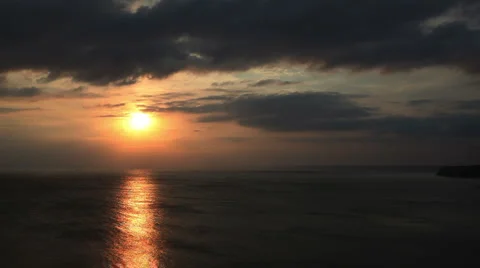 Timelapse sunset clouds dark sky ocean sea golden waves background cape Kalia 스톡 동영상 1069693