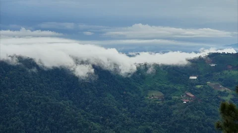 Timelapse at sunset. Clouds flow over mountains covered by rainforest. Stock Footage 120891602