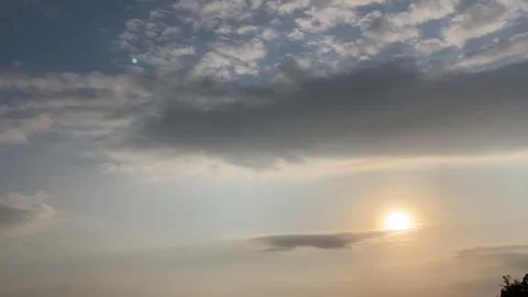Timelapse sunset with clouds flowing fr left to top right Stock Footage 250043375