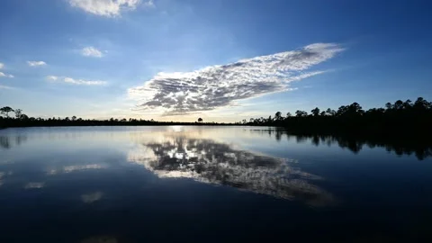 Timelapse of sunset clouds over Pine Glades Lake in Everglades National Park 4K. Stock Footage 220313915