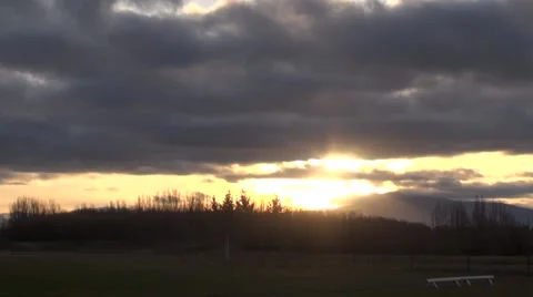 Timelapse of Sunset on a cloudy night in New Zealand Stock Footage 49580496