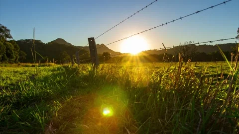 Timelapse Sunset Focus Pull Behind Fence Farm Stock Footage 139084055