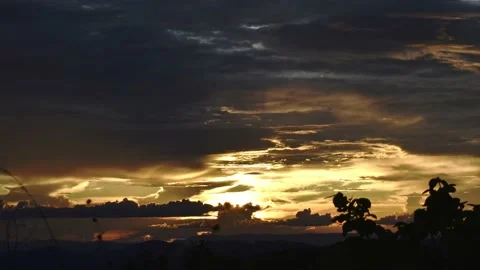 Timelapse of a Sunset in Golden hour, With Clouds and mountains - zoom out Stock Footage 151335880