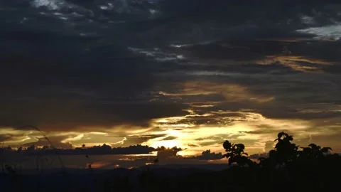 Timelapse of sunset in golden hour with clouds and moutains - zoom in 4k Stock Footage 151335890