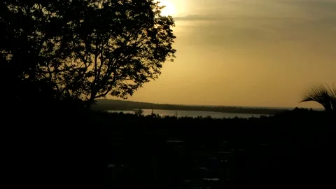 Timelapse of sunset in a lagoon getting covered by clouds 4K Stock Footage 213337847