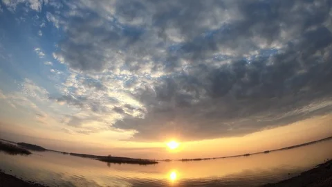 Timelapse sunset on the lake. Evening sunset on the river. Stock Footage 106754305