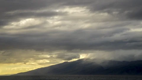 Timelapse of Sunset Light on Beautiful Clouds Over Molokai From West Maui Stock Footage 129045440