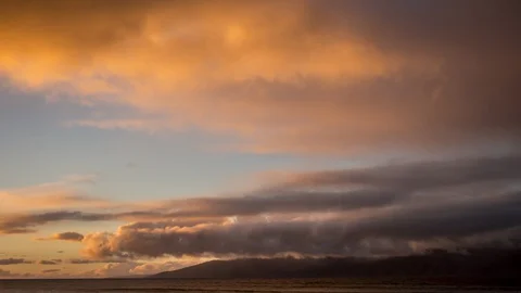 Timelapse of Sunset Light on Beautiful Slow-Moving Clouds from West Maui Stock Footage 129043480