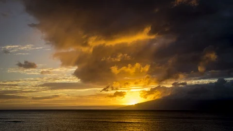 Timelapse of Sunset Light with Smoothly Moving Clouds Over Maui and Molokai Stock Footage 128989941