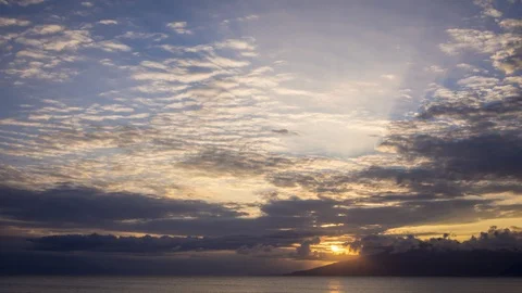 Timelapse of Sunset Light on Unusual Clouds Over Lanai From West Maui Stock Footage 128987488