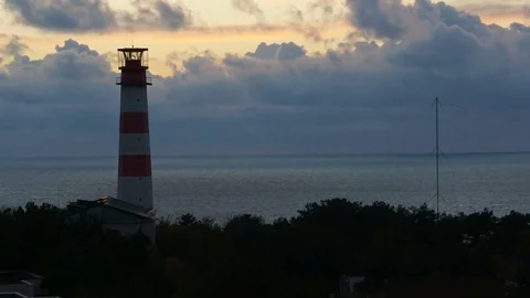 Timelapse sunset with lighthouse on the sea under stormy clouds in the Stock Footage 82813908