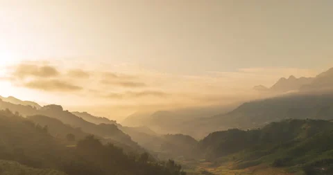 Timelapse Sunset mountain range beautiful landscape mist, dusk golden time drama Stock Footage 160792897