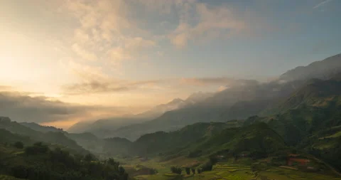 Timelapse Sunset mountain range beautiful landscape mist, dusk golden time drama Video stock 160793445