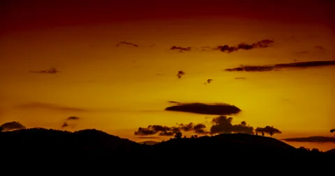 Timelapse Sunset mountain range beautiful landscape mist, dusk golden time drama Stock Footage 253868017
