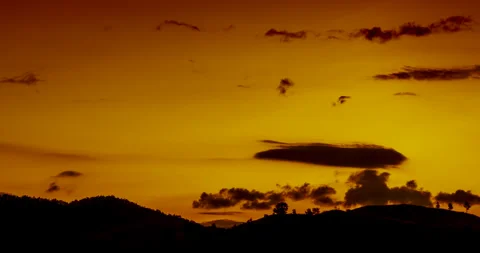 Timelapse Sunset mountain range beautiful landscape mist, dusk golden time drama Stock Footage 253868018