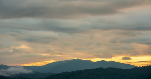 Timelapse Sunset mountain range beautiful landscape mist, dusk golden Stock Footage 276680562