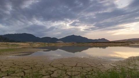 Timelapse sunset with moving cloud over land drought of water Stock Footage 86141506