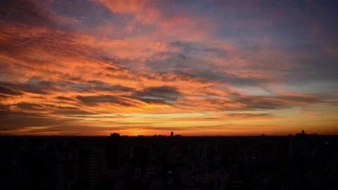 Timelapse of sunset with moving colorful clouds in Buenos Aires Video stock 134748838