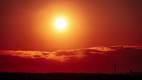 Timelapse Sunset Moving Down in Orange Sky with Clouds Stock Footage 253469954