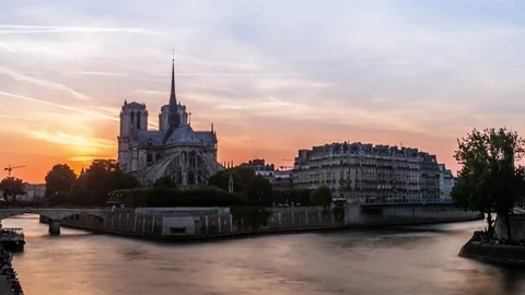 Timelapse Sunset with Notre-Dame Cathedral and the Seine river in Paris, France Stock Footage