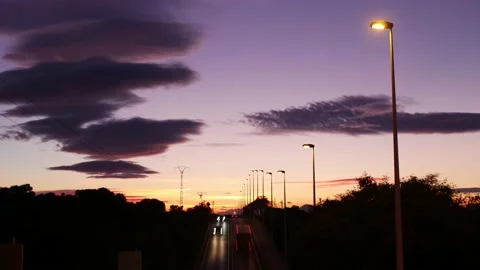Timelapse of a sunset over a busy road. Nice colours. Video stock 167210286