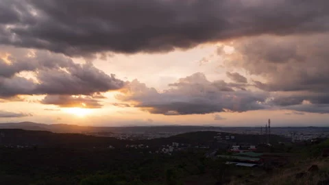 Timelapse - Sunset over a city with clouds 4K60 Stock Footage 270431992