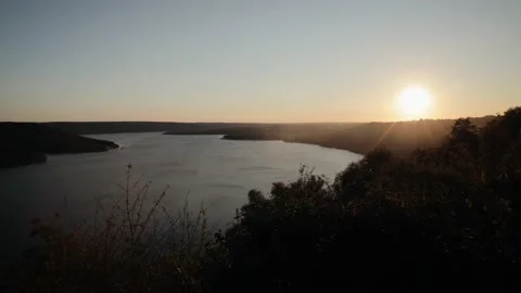 Timelapse of sunset over Dniester river with few clouds in the sky and orange Stock Footage 163033365
