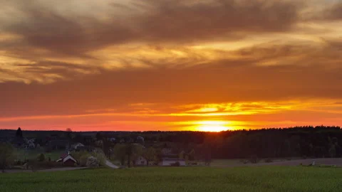 Timelapse of sunset over fields in Poland. Beautiful sunset with dramatic sky Stock Footage 153988747