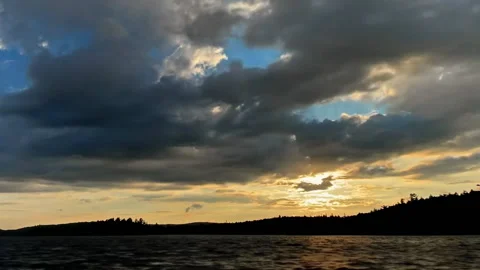 Timelapse sunset over lake behind clouds Stock Footage 201272388