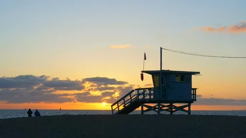 Timelapse sunset over Lifeguard tower Stock Footage 86831346