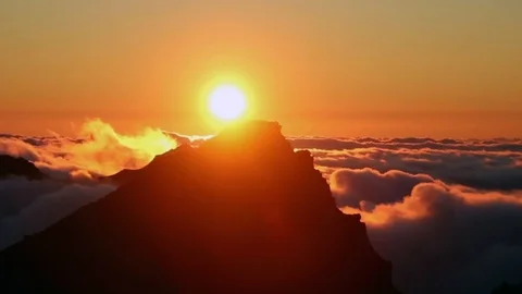Timelapse of sunset over mountain tops with flowing clouds Stock Footage 126505549