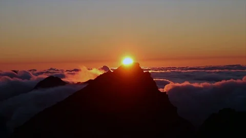 Timelapse of sunset over mountain tops with flowing clouds Stock Footage 126507375