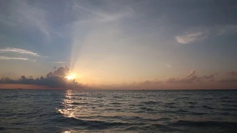 Timelapse of the sunset over the ocean with some clouds Stock Footage 82064831