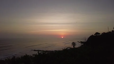 Timelapse of sunset over Pacific ocean and coastal cliffs Lima Peru Video stock 348697297