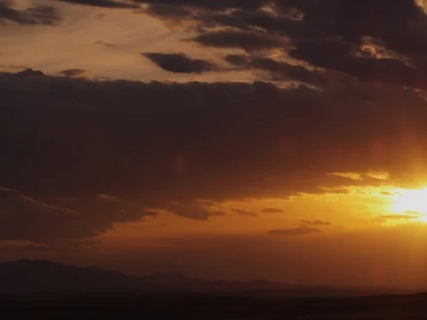 Timelapse - Sunset over prairie mountains Stock Footage 81187082