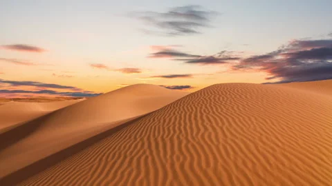 Timelapse of sunset over the sand dunes in the desert. Gobi desert Stock Footage 264864560