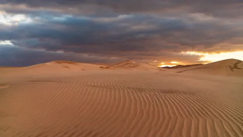 Timelapse of sunset over the sand dunes in the desert. Sahara desert Stock Footage 265883063