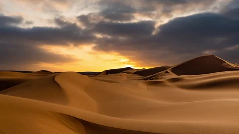 Timelapse of sunset over the sand dunes in the desert. Gobi desert Stock Footage 267586526