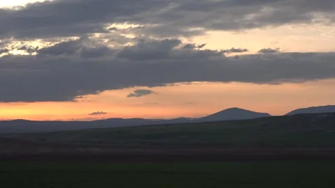 Timelapse sunset sky Chad dark storm clouds glowing dusk light evening weather Stockbeeldmateriaal 339571013