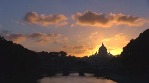 Timelapse sunset sky cloud pass St Peters church dome Rome water reflection icon Stock Footage 44681538