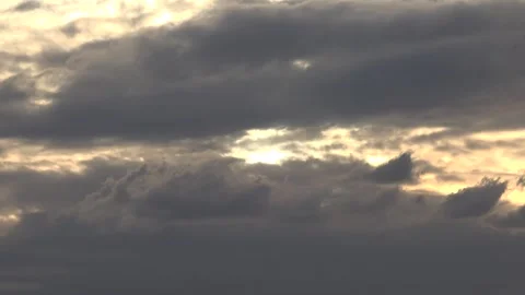 Timelapse sunset sky dark storm clouds glowing - Cloud Texture and Sky Gradient Stockbeeldmateriaal 339571076