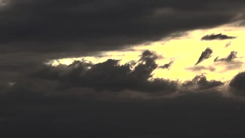 Timelapse sunset sky dark storm clouds glowing dusk - Sky Gradient and Arid Sky Stockbeeldmateriaal 339571164