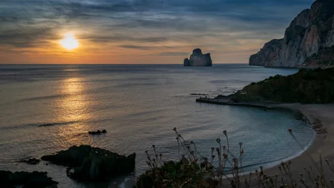 Timelapse at sunset in the suggestive setting of the Masua inlet Stock Footage 138327183