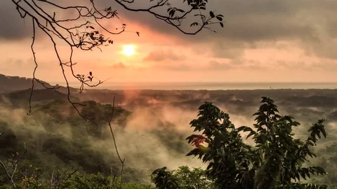 Timelapse of sunset. Sun going down at the sea, fog and mist Stock Footage 70610401