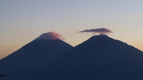 Timelapse of sunset at two volcanoes. Stock Footage 108460131