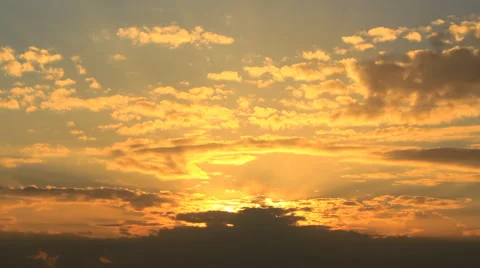 Timelapse sunset with yellow puffy clouds Stock Footage 62274693