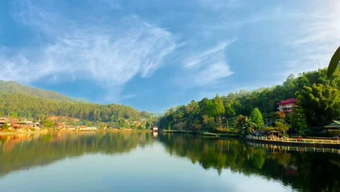 Timelapse Swamp with Time lapse blue sky and Green mountain background. Stock Footage 133023716