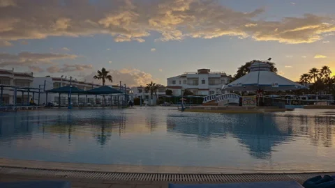 A Timelapse of swimming pool at a resort during sunset. Stock Footage 331159811